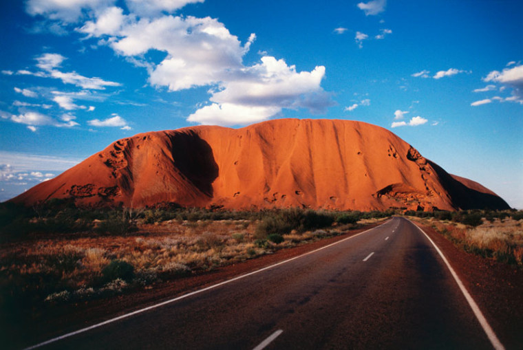 The sight of Central Australia's famed Uluru — also referred to as Ayers Rock — looming on the horizon, is enough to stop you dead in your tracks and utter superlatives reserved for the truly awesome.